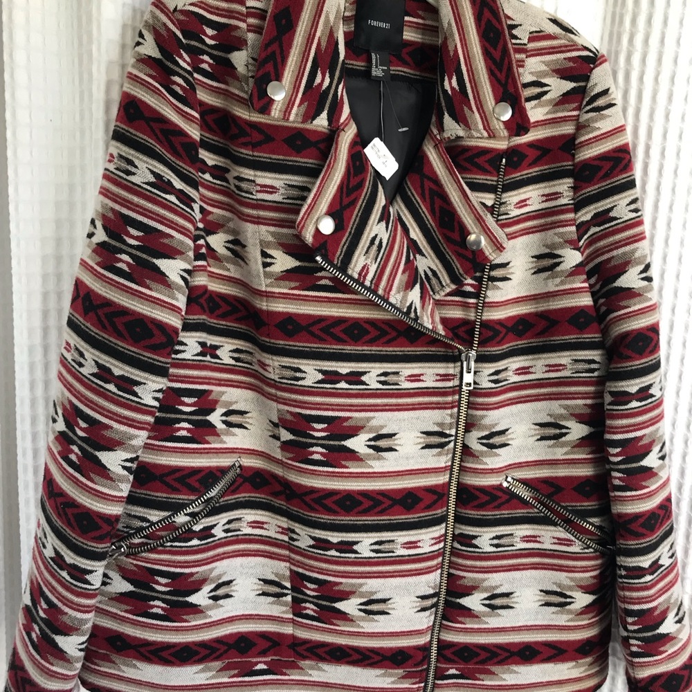 Light, zipper jacket. Aztec design. Unusual.